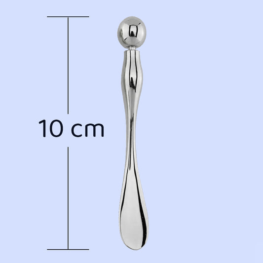 Spatola cosmetica dotada de esfera para massagem facial e contorno dos olhos